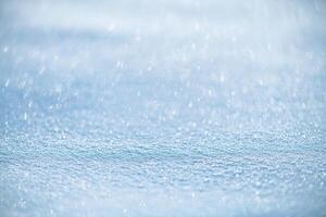 natural winter background, fresh fluffy snow, sun glare photo