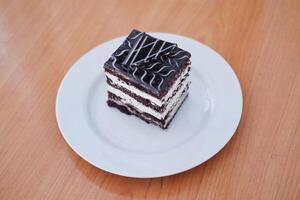 Delicious chocolate cake on a white plate photo