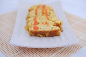 Slices of omelet on a plate photo