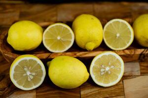 lemon fruits on olive wood photo