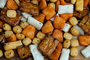 Different types of Japanese rice cakes on olive wood photo