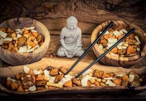 Different types of Japanese rice cakes on olive wood photo