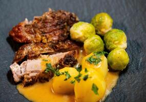 Roast turkey with Brussels sprouts potatoes and gravy photo