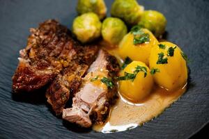 Roast turkey with Brussels sprouts potatoes and gravy photo