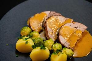 Roast turkey with Brussels sprouts potatoes and gravy photo