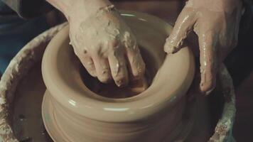 A potter makes a jug on a pottery table video