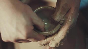 A potter makes a jug on a pottery table video