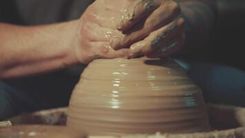 the hands of a potter making a jug of clay video