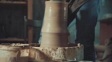 the hands of a potter making a jug of clay video