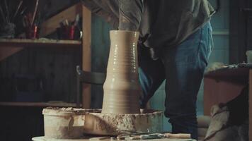 the hands of a potter making a jug of clay video