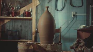 a pitcher of clay on a potter's wheel before firing video