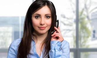 Portrait of a beautiful woman wearing headset photo