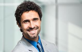 Smiling businessman in his office photo