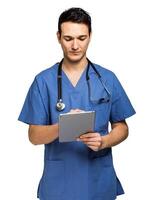 Male nurse using a digital tablet isolated on white photo
