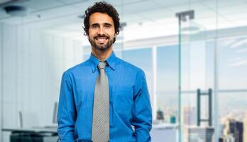 Portrait of a handsome businessman in a modern office photo