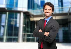 Smiling confident businessman photo