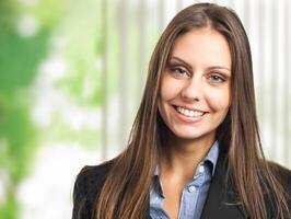 Friendly female manager portrait in her office photo