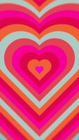 Soft Pink to Orange Hearts in a Vibrant Gradient Loop. Vertical Background video