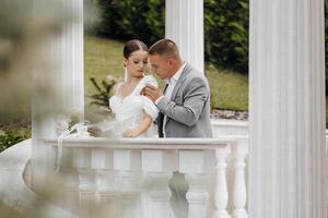 Beautiful and sensual wedding couple in the park. High quality photo. photo