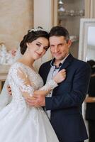 A beautiful bride with her father on her wedding day. The best moments of the wedding day. Daughter and father. photo