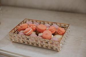 Macaroons Close-up of a candy bar at a wedding banquet. A delicious reception, a luxurious ceremony. Table with sweets and desserts. Delicious colorful French desserts on a plate or table. photo