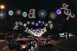 Christmas decorations on the streets of Alicante, Spain at night photo