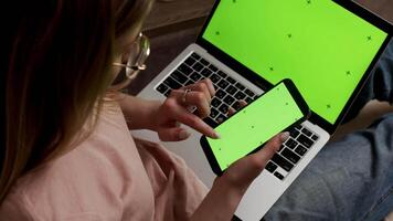 Close Up of Anonymous Designer Working on a Laptop Computer with Mock Up Green Screen Chromakey Display with Isolated Placeholder. Video Template for Artistic Content Creation and Presentations.