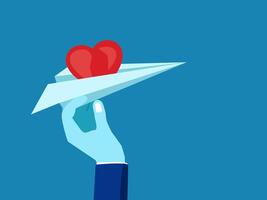 Sending love and thoughts. holding a heart on a paper plane vector