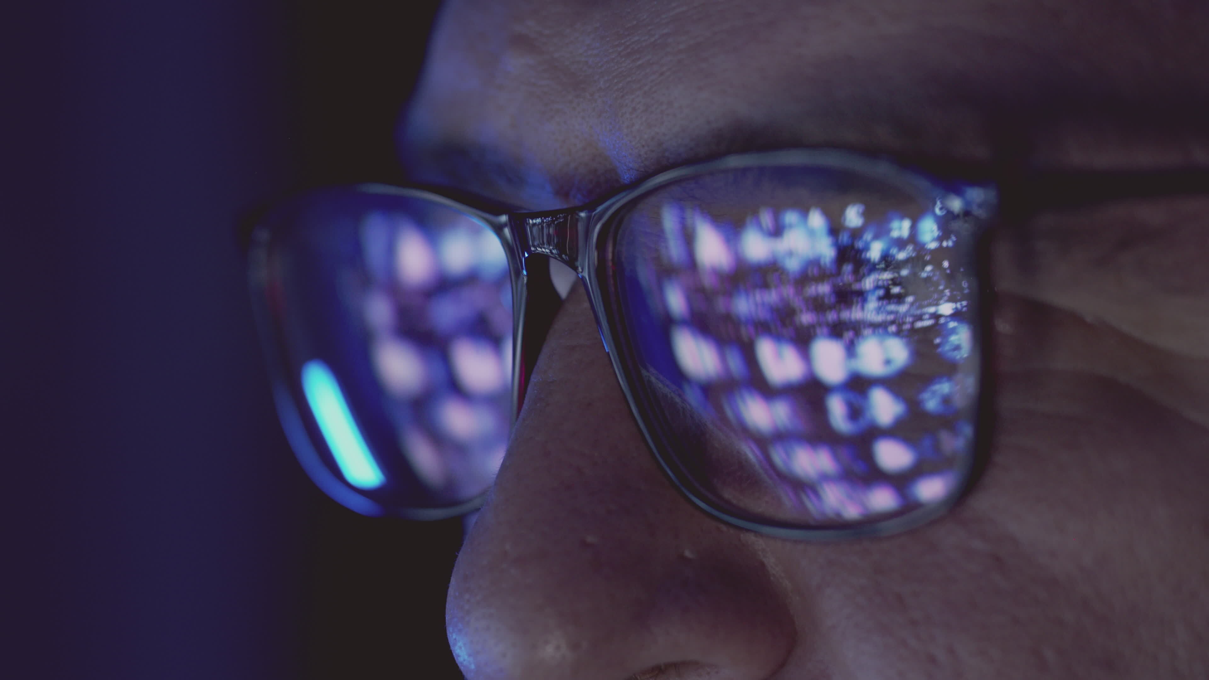 Close up view of focused businessman wears computer glasses for