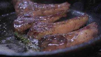 Onions are thrown to the cast iron pan fried in butter video