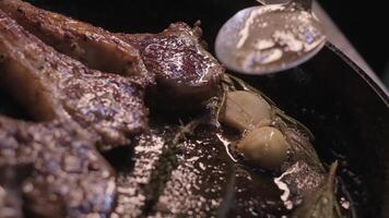 Onions are thrown to the cast iron pan fried in butter video