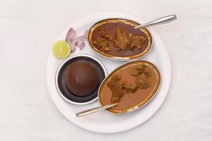 Ragi Ball With Nati Style Chicken Curry and Mutton Curry photo