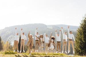 friendship, movement, action, freedom and people concept - group of happy teenagers or school friends jumping and having fun outdoors on the background of a beautiful place. photo