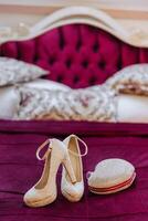 Details of the bride. Beauty is in the details. High-heeled bridal shoes. Gold wedding ring with a diamond. Perfumes. Earrings Wedding in details. photo