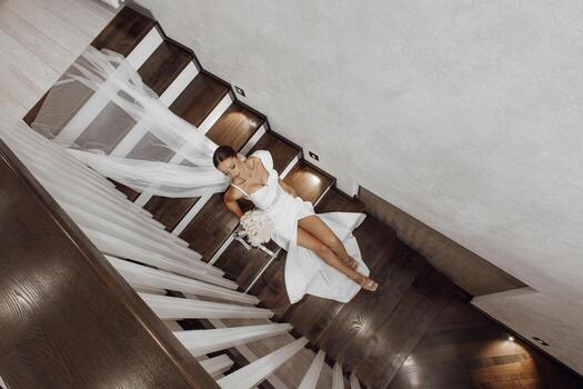 Beautiful bride, fashionable portrait in a stylish interior. Brunette bride, happy woman wearing wedding white dress with wedding makeup and hairstyle. Top photo of the bride. Newlyweds
