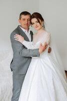 A beautiful bride with her father on her wedding day. The best moments of the wedding day. Daughter and father. photo