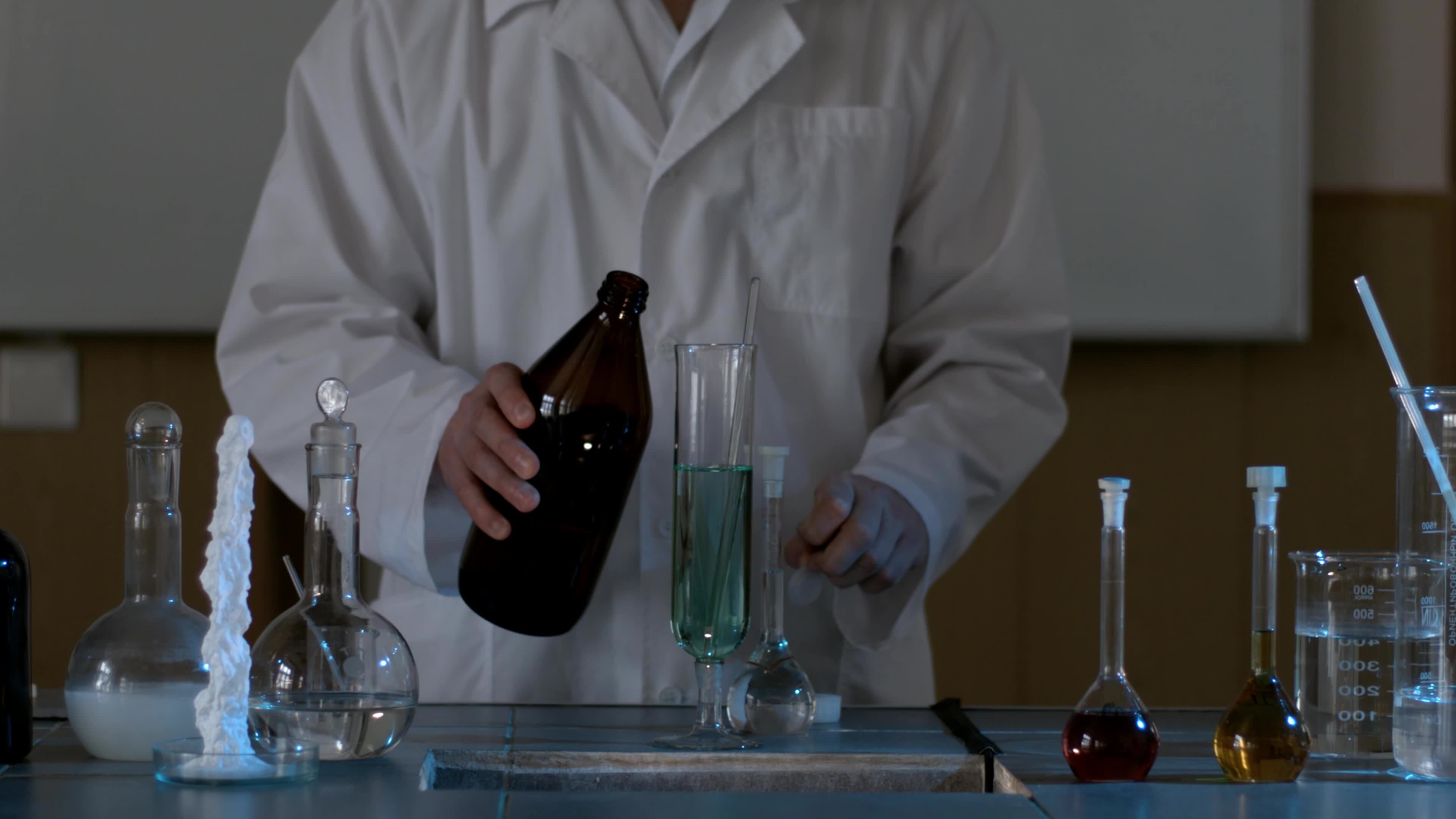 Water purification test. Drop blue liquid in test tube with clean water