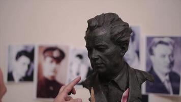Sculptor created a figure of a man. Clip. Man creates his own hands the bust of a man. Concept art video