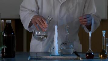 Scientist in a laboratory conducting an experiment on the instantaneous transformation of the liquid into ice. The chemical effect of the liquid or water will instantly freeze video