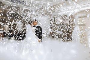 the wedding of the bride and groom in an elegant restaurant with great light and atmosphere. The first dance of the bride and groom. photo