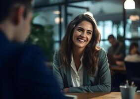 AI generated Smiling confident businesswoman leader in an office with team colleagues worker. Meeting in a boardroom. Using digital tablet and laptop during discussion. photo