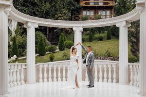 Beautiful and sensual wedding couple in the park. High quality photo. photo