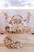 Luxurious, elegant decoration for the wedding reception, flower compositions for the wedding photo zone, decorated with flowers for the bride's prisidium