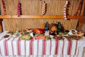 Cossack table. Banquet hall Meat treats for guests. Homemade cutouts. Pork tenderloin. Delicious meat cuts. Meat plate. Delicious compositions from smoked mint. Cottage cheese. photo