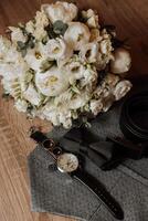 Men's accessories, groom details. Beauty is in the details. Preparation for the Wedding. Leather shoes. Gold wedding rings. Bow tie. Wedding bouquet of flowers. photo