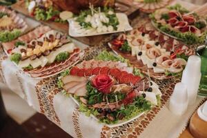 Cossack table. Banquet hall Meat treats for guests. Homemade cutouts. Pork tenderloin. Delicious meat cuts. Meat plate. Delicious compositions from smoked mint. Cottage cheese. photo