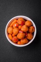 Delicious fried potato balls with vegetables, salt, spices and herbs photo