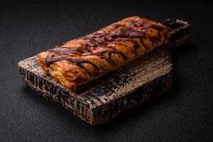 Delicious crispy sweet puff pastry with chocolate and salted caramel photo