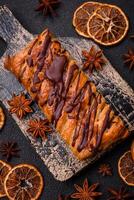 Delicious crispy sweet puff pastry with chocolate and salted caramel photo