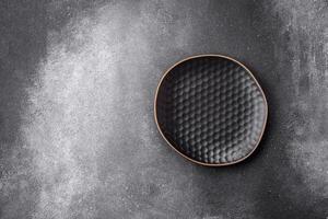 Empty round ceramic plate on a light texture background photo